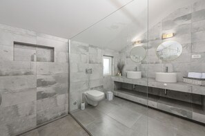 Shower, hair dryer, slippers, towels