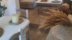 A cozy living room with a sofa, a coffee table, and a wall with a motivational quote. - RUSTIC VACATION HOUSE (Mondariz)