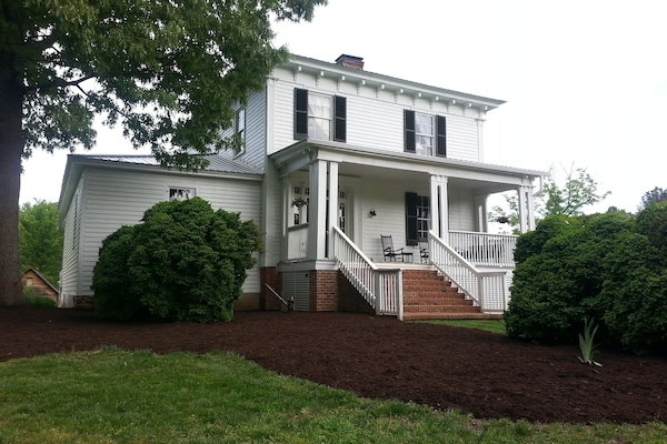 The front view before a wedding ceremony in the side yard.