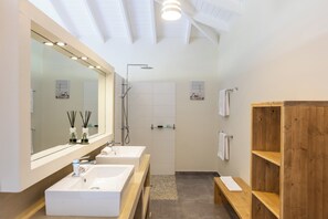 Shower, hair dryer, towels, toilet paper