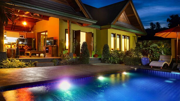 A modern house with a swimming pool, a well-lit interior, and a patio area. - Private Villa with Swimming pool, jetted Plunge Pool and Free Transfers (Koh Samui)