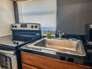 Fridge, microwave, stovetop, coffee/tea maker