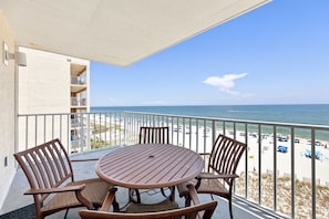 Outdoor dining - 2BR Corner beachfront condo w/ pool & hot tub (Gulf Shores)