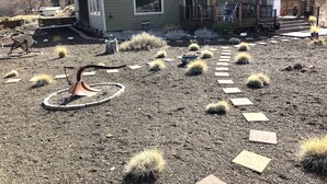A house with a patio, a small garden with cacti, and a mountain in the background. - Vacation and Business Get-A-Way/Lay-Over (John Day)