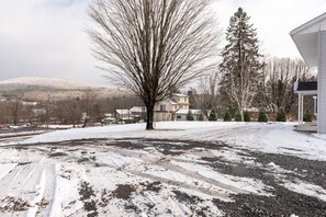 Set amidst a serene winter landscape, this house offers a peaceful retreat.