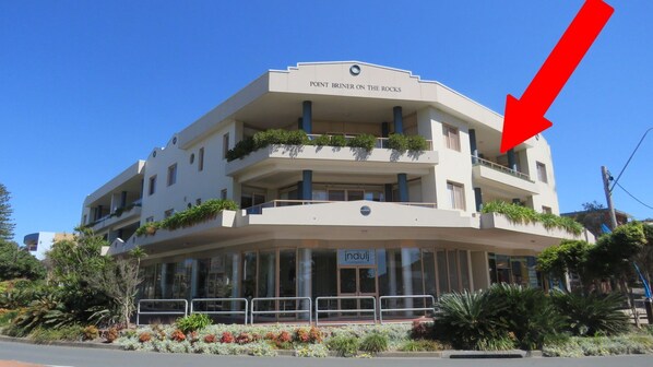A multi-story hotel with balconies and a sign reading "Point Briner on the Rocks." - POINT BRINER UNIT 3 - THREE BEDROOM WITH MAIN BEACH VIEWS (South West Rocks)