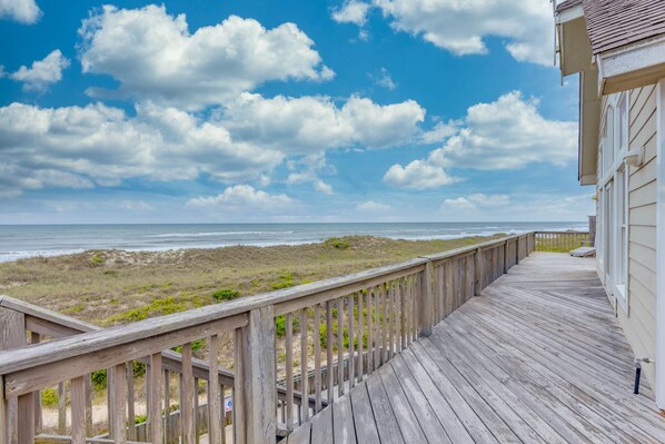 A wooden deck with a view of the beach and ocean. - Oceanfront Home w/ Private Pool, Hot Tub, Elevator, Game Room, Home Theater (Frisco)