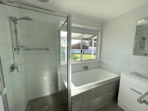Shower, hair dryer, towels, toilet paper