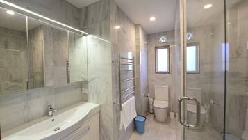 Shower, hair dryer, towels, soap
