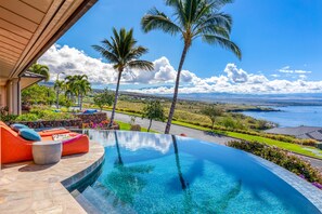 An infinity pool, sun loungers