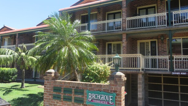 A multi-story hotel with a brick facade, balconies with white railings, and a sign indicating "Birchgrove Terraces". - BIRCHGROVE 3 - 400 METRES TO BEACH (SOUTH WEST ROCKS)