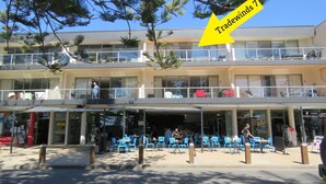 A multi-story hotel with outdoor seating and a visible balcony. - TRADEWINDS UNIT 7 - BEACH VIEWS (South West Rocks)