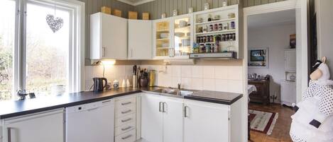 Fridge, stovetop, dishwasher, coffee/tea maker