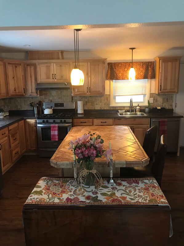 Dishwasher, coffee/tea maker, cookware/dishes/utensils