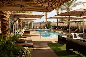 Outdoor pool, open 8:00 AM to 10:00 PM, free pool cabanas