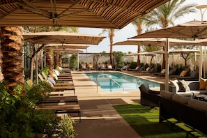 Outdoor pool, open 7:00 AM to 10:00 PM, free cabanas, pool umbrellas