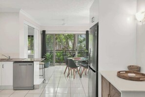 Fridge, microwave, oven, stovetop - Official Lakes Resort One Bedroom Apartments (Cairns North)