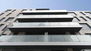 A modern building with multiple balconies and large windows. - Seattle | The Rentals Collection (San Sebastián)