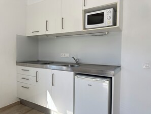 Fridge, microwave, coffee/tea maker, toaster