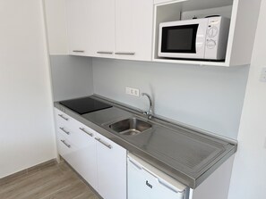 Fridge, microwave, coffee/tea maker, toaster