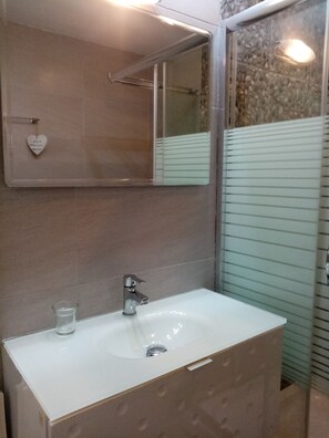 Shower, hair dryer, towels, soap