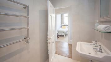 Bathtub, hair dryer, towels