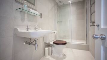 Bathtub, hair dryer, towels