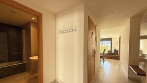 A modern interior with a bathroom, a hallway, and a living area. - Agi Riera Ginjolers 3B Apartamento for rent in Roses Girona. (Roses)