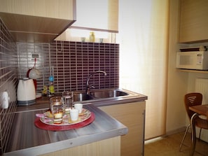 Apartment | Private kitchen | Full-size fridge, microwave, oven, stovetop
