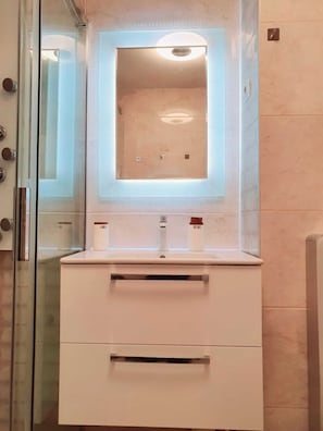 Shower, hair dryer, towels, soap