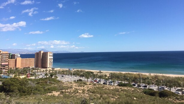 A coastal hotel with multiple floors, a parking area, and a beach view. - BUNGALOW WITH TERRACE 50M2,500M TO THE BEACH (Los Arenales del Sol)