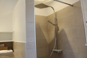 Shower, hair dryer, towels, toilet paper