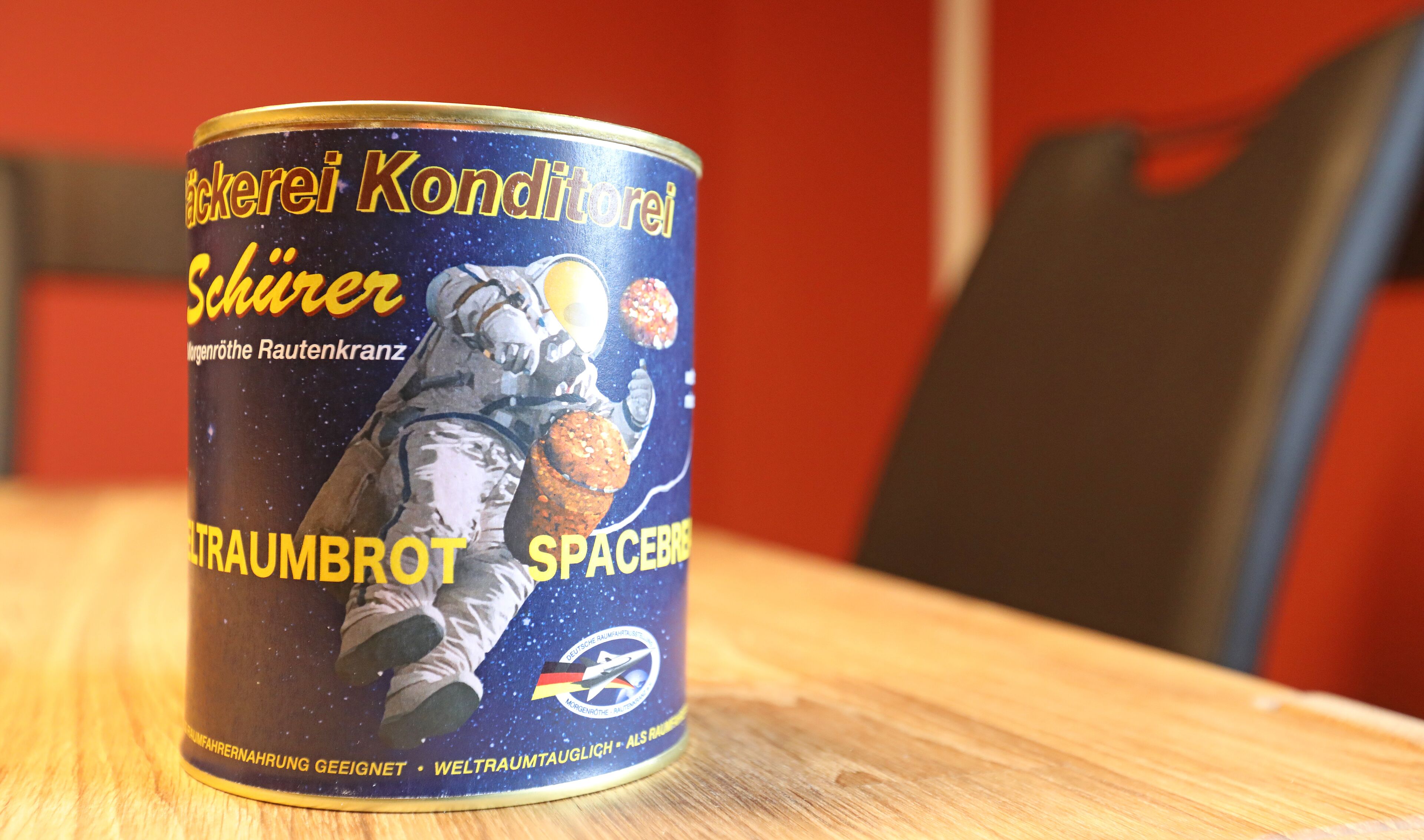 A can of Schwarer brand space food with an astronaut illustration.