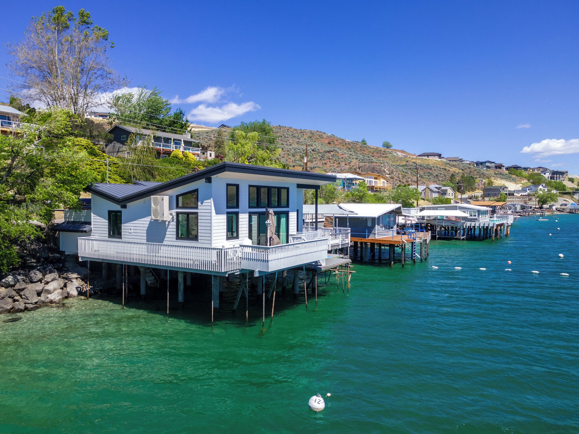  NEW, Completely remodeled! Over the Lake Waterfront Home with Boat Access