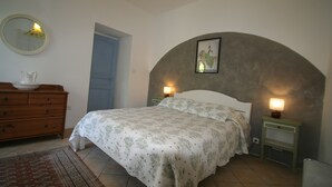 A bedroom with a bed, dresser, and nightstands. - Large gîte by the river, private terrace,  (Le Tech)