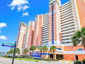 A multi-story hotel with a prominent BayWatch sign, located at 28th Avenue South, Crescent Beach.