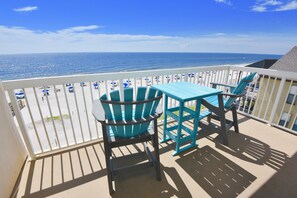 A balcony with a view of the beach and ocean. - Dog friendly beachfront condo with sunset views (Gulf Shores)