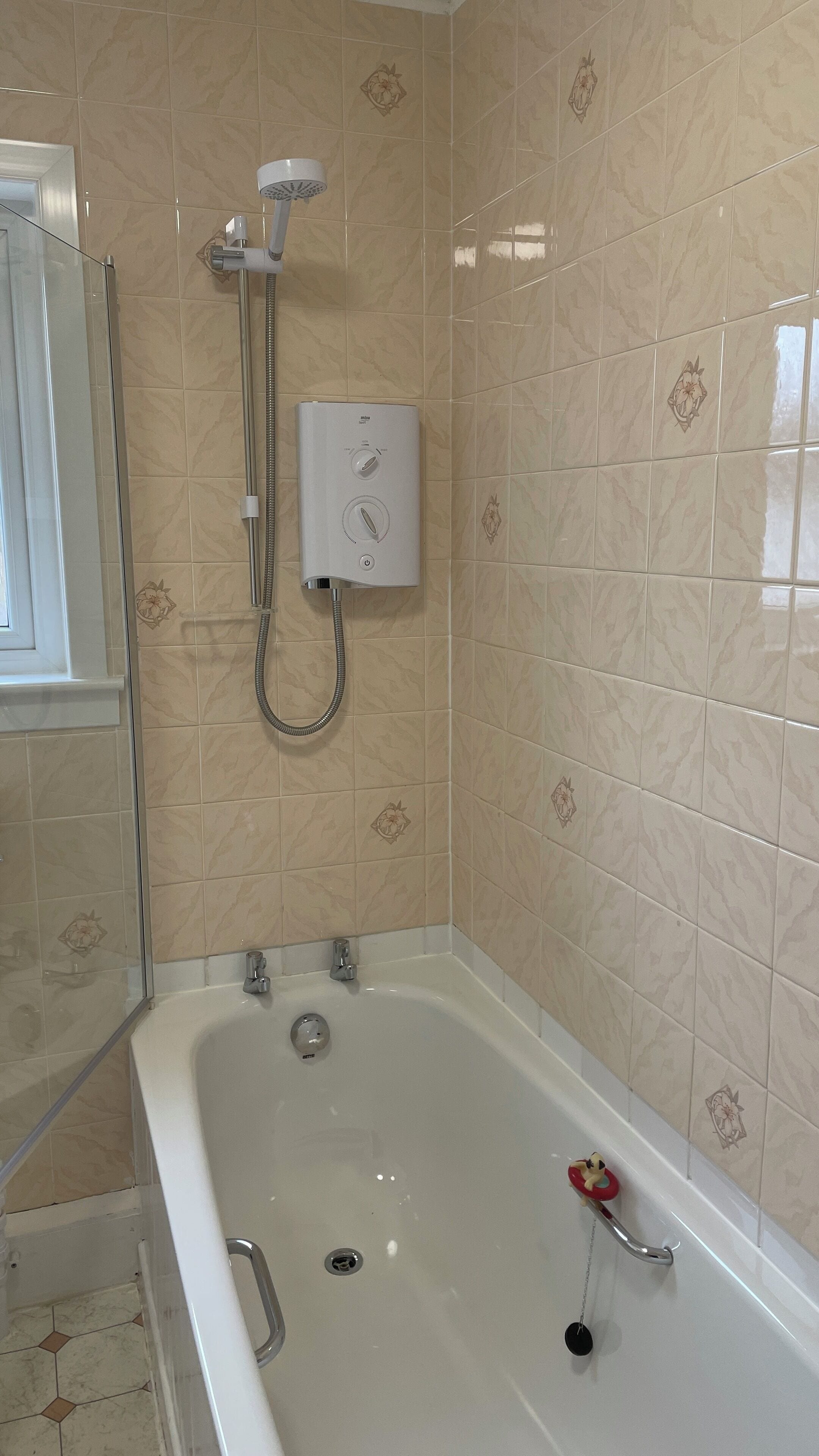 A bathroom with a bathtub, a shower, and a toilet.