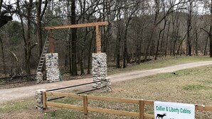 A wooden cabin structure with stone pillars and a ladder. - Liberty Cabin on Collier creek!! In Caddo Gap (Norman)