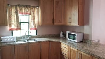 Comfort Apartment, Ocean View | Private kitchen | Full-size fridge, microwave, oven, stovetop