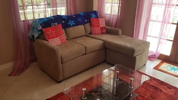 Comfort Apartment, Ocean View | Living area | Flat-screen TV