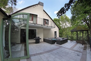 Enjoy outdoor entertaining on the spacious patio with a grill and seating area.
