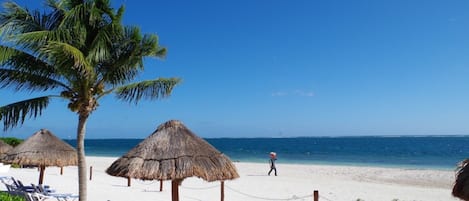 On the beach, sun-loungers, beach towels