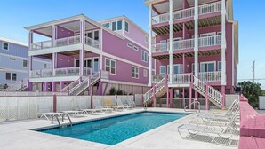 A multi-story building with balconies and a swimming pool. - Sundancer, East. Beachfront 5BR Pool! PERFECT location. 😎 (Gulf Shores)
