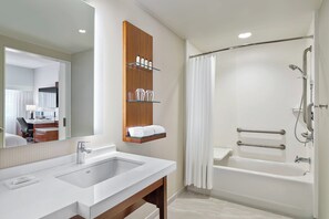 Hydromassage showerhead, designer toiletries, hair dryer, towels