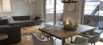 Sunny, modern mountain apartment with large balcony facing south-west centrally