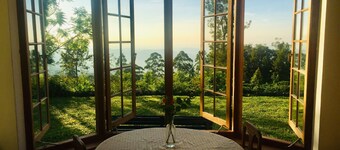 Full board on an organic tea estate high in the hills - whole cottage with staff