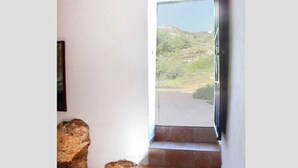 A staircase leading to a balcony with a view of a hilly landscape. - Gorgeous Andalusian house in a protected Nature Reserve (Nerja)