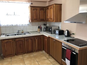 Fridge, microwave, oven, stovetop - Bon Accord Beaulieu , an ideally located two bedroom apartment (Tobago)