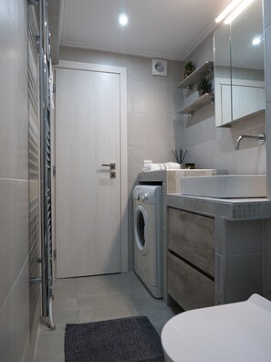 Hair dryer, towels, soap, shampoo